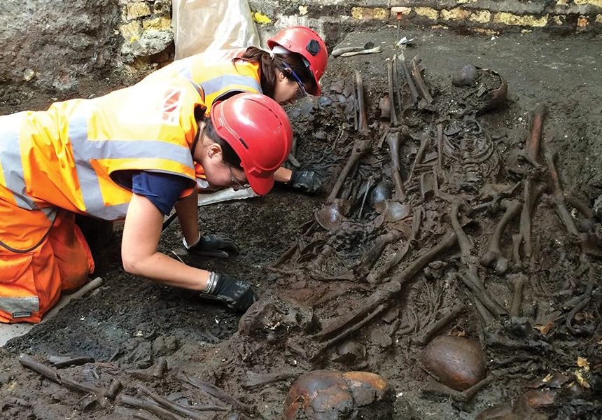 Archaeologists began excavating up to 3,000 skeletons from a burial ground under London's Liverpool Street station.